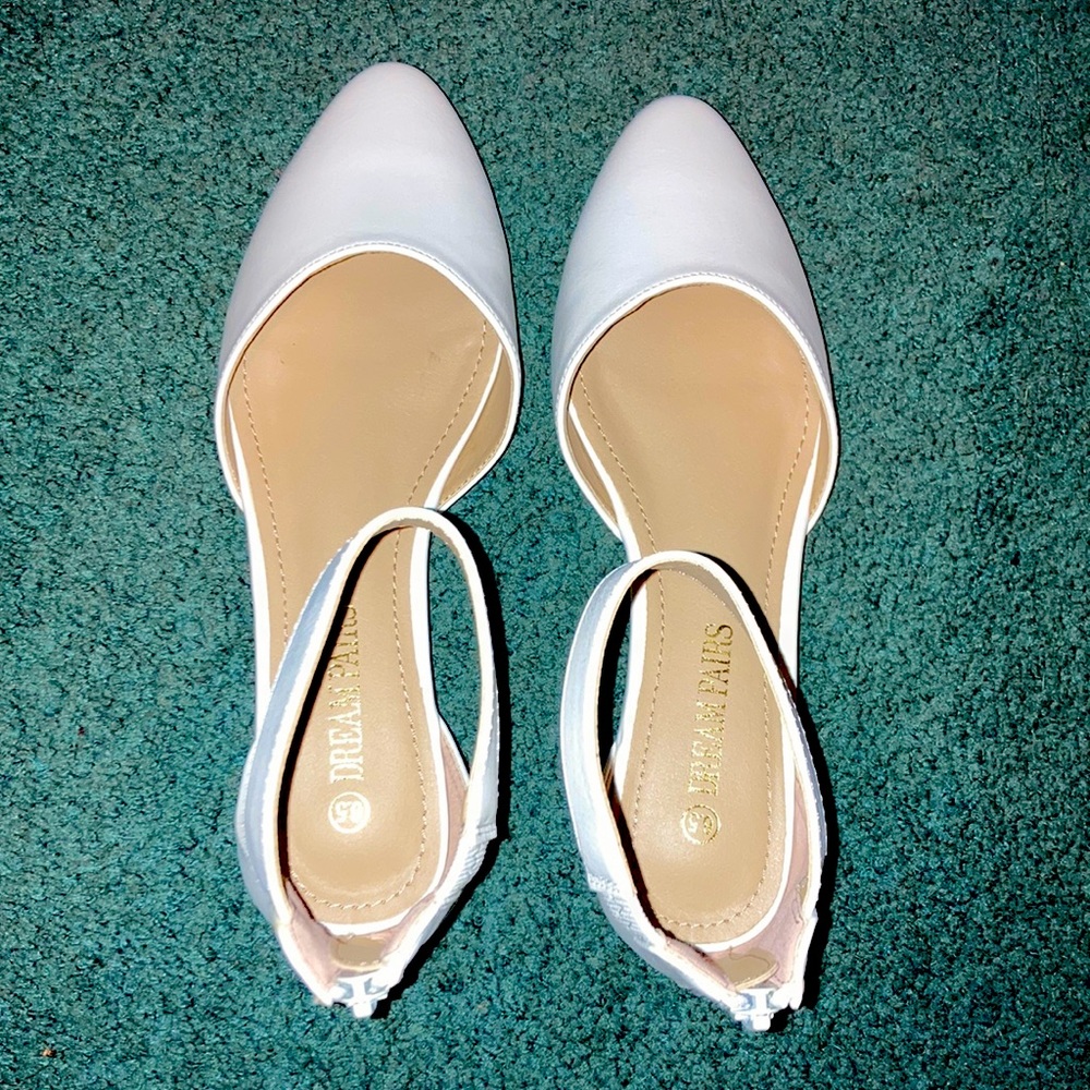 White pointed toe flats with back zipper and ankle strap